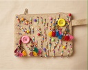 Playful Beaded Clutch